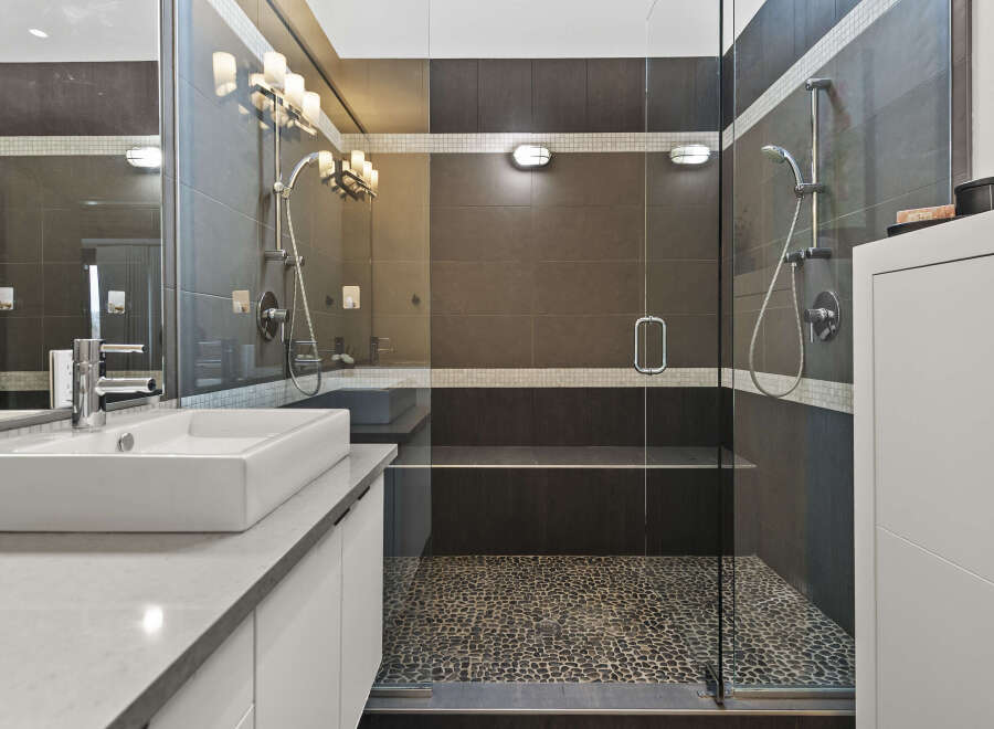 Step into luxury with this stunning bathroom featuring a modern design.