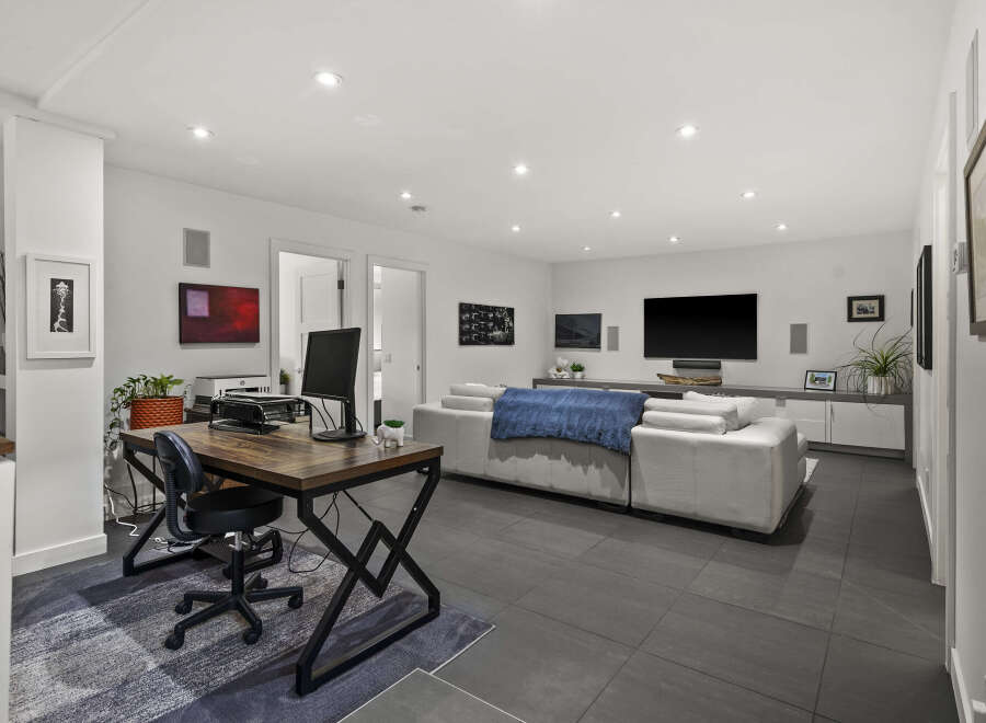 This modern living space is perfect for both work and relaxation.