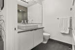 This modern bathroom boasts a sleek design with a minimalist aesthetic.