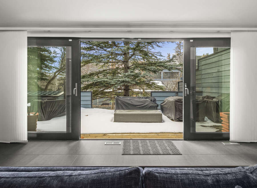 Step into a world of tranquility with this stunning property, featuring expansive sliding doors that seamlessly blend indoor and outdoor living.