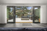 Step into a world of tranquility with this stunning property, featuring expansive sliding doors that seamlessly blend indoor and outdoor living.