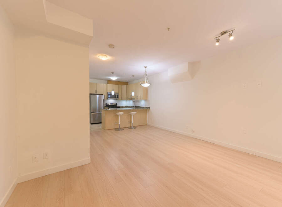This stunning property boasts a modern kitchen with sleek cabinetry and stainless steel appliances, perfect for culinary enthusiasts.
