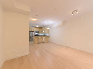 This stunning property boasts a modern kitchen with sleek cabinetry and stainless steel appliances, perfect for culinary enthusiasts.