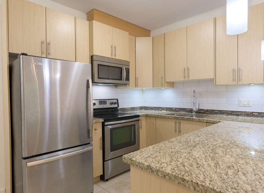 This stunning kitchen boasts modern appliances and ample storage space, perfect for culinary enthusiasts.