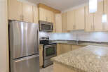 This stunning kitchen boasts modern appliances and ample storage space, perfect for culinary enthusiasts.