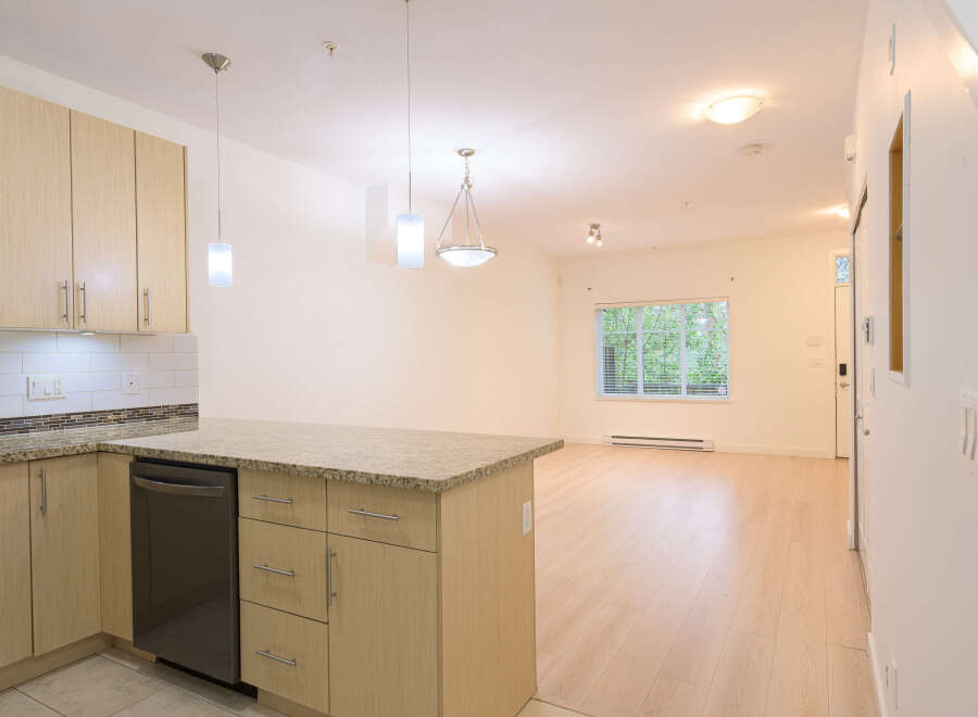 This stunning property boasts a modern kitchen with sleek cabinetry and granite countertops, perfect for culinary enthusiasts.