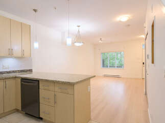 This stunning property boasts a modern kitchen with sleek cabinetry and granite countertops, perfect for culinary enthusiasts.