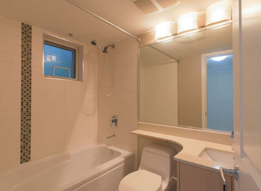 This inviting bathroom features a clean and modern design, perfect for relaxation.