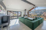 Experience luxury living in this stunning property, featuring a spacious living area with breathtaking mountain views.