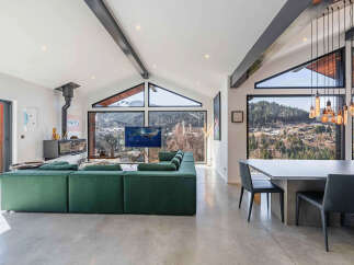 Experience luxury living in this stunning property, boasting a modern design and breathtaking mountain views.
