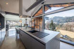 This stunning kitchen boasts a modern design with sleek cabinetry and a spacious island, perfect for culinary enthusiasts.