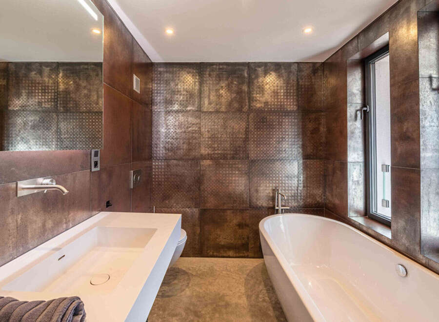 Step into luxury with this stunning bathroom featuring a modern design and high-end finishes.