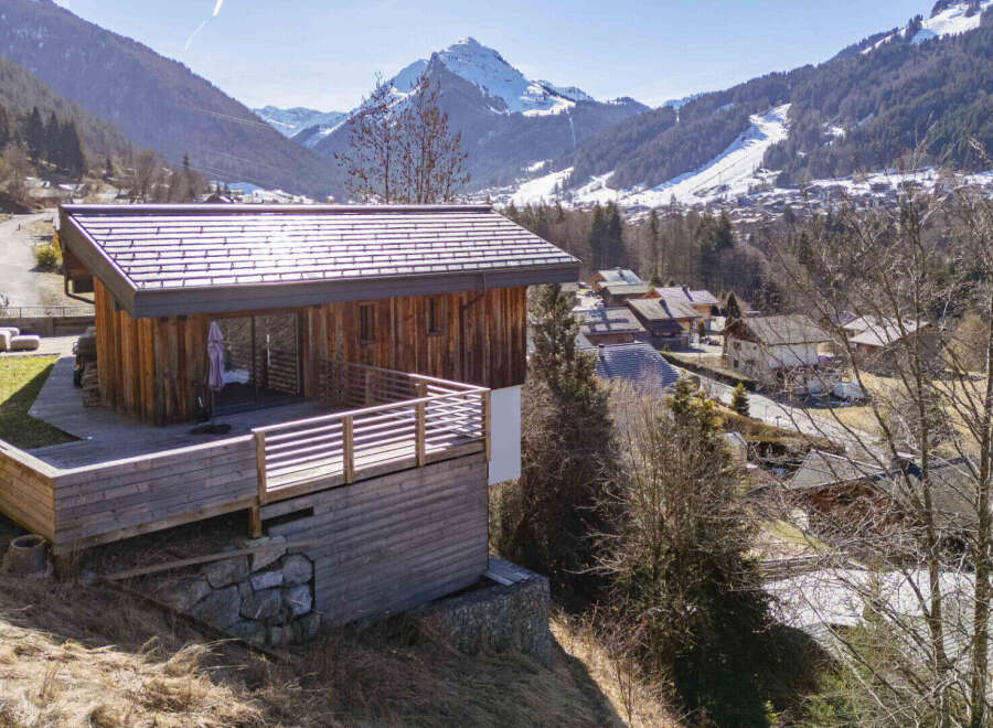 Nestled in a picturesque mountain setting, this stunning wooden cabin offers a serene retreat.