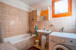 This cozy bathroom features a combination of functionality and style, perfect for everyday living.
