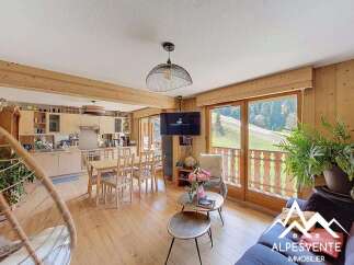 Experience the charm of this stunning property, featuring a bright and airy living space with wooden accents.