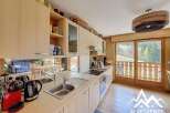 This stunning kitchen boasts a modern design with sleek cabinetry and stainless steel appliances.