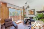 This charming property boasts stunning views and a cozy interior.