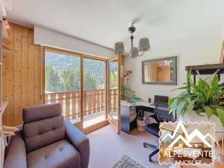This charming property boasts stunning views and a cozy interior.