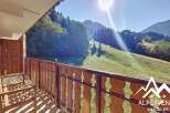 Enjoy breathtaking mountain views from this charming balcony.