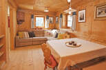 This charming wooden cabin interior offers a cozy and inviting atmosphere.