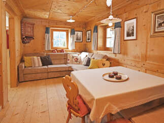 This charming wooden cabin interior offers a cozy and inviting atmosphere.