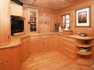 This stunning property boasts a beautifully crafted wooden interior, creating a warm and inviting atmosphere.