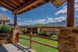 Enjoy the stunning mountain views from this covered patio, perfect for outdoor living.