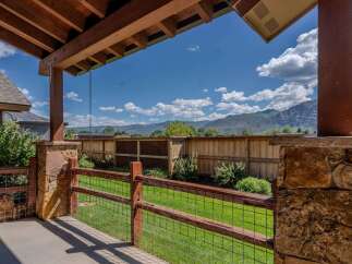 Enjoy the stunning mountain views from this covered patio, perfect for outdoor living.