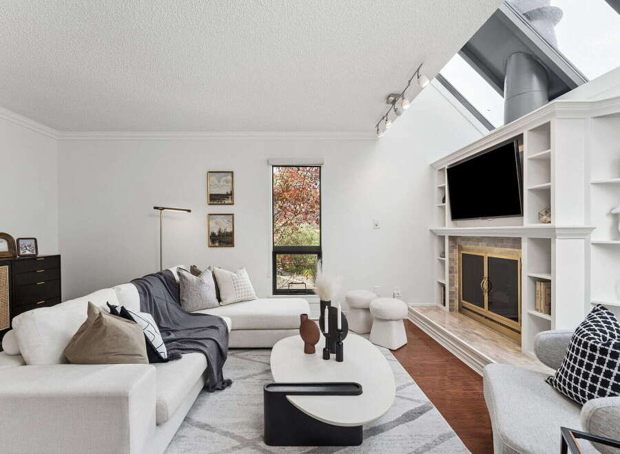 Step into luxury with this stunning living room, featuring a modern design and ample natural light.
