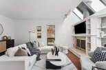 Step into luxury with this stunning living room, featuring a modern design and ample natural light.