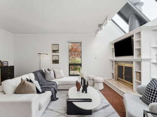 Step into luxury with this stunning living room, featuring a modern design and ample natural light.