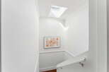 This stunning property features a bright and airy staircase with a modern design.