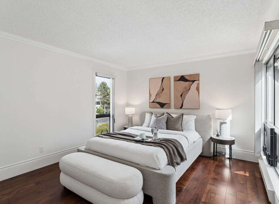 This stunning bedroom boasts a modern and inviting design, perfect for relaxation.