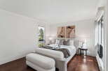 This stunning bedroom boasts a modern and inviting design, perfect for relaxation.
