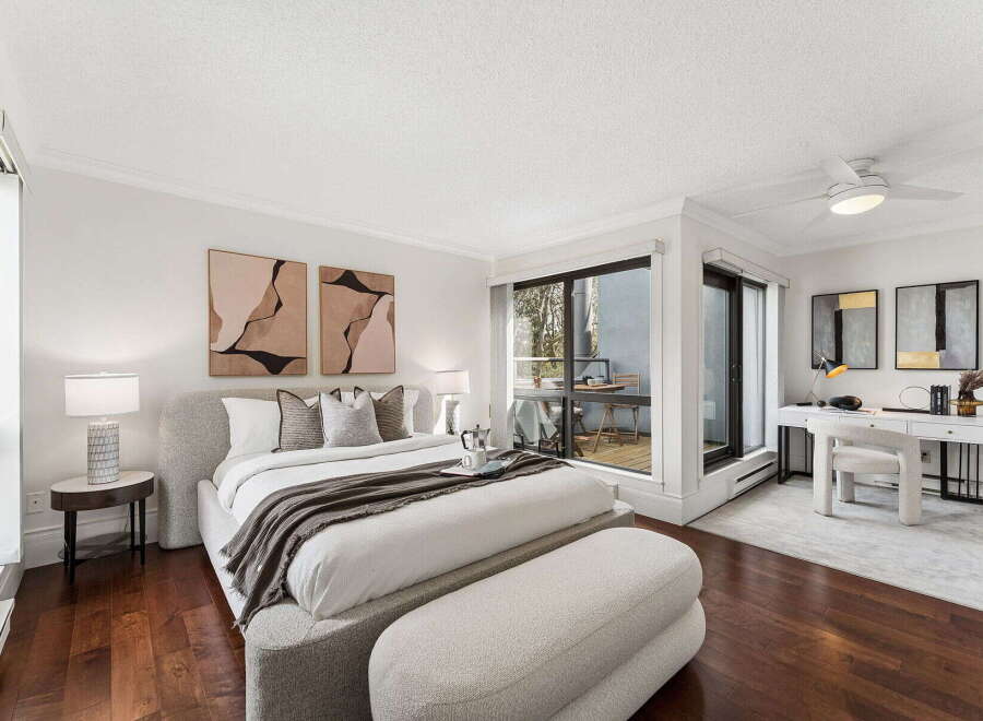 Step into luxury with this stunning bedroom featuring a modern design and ample natural light.