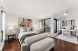 Step into luxury with this stunning bedroom featuring a modern design and ample natural light.