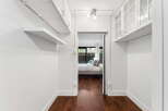 Step into this bright and airy space, featuring pristine white walls and elegant hardwood floors.