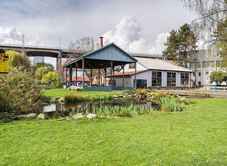 Discover a charming property featuring a picturesque pond and lush green lawns, perfect for relaxation and outdoor activities.