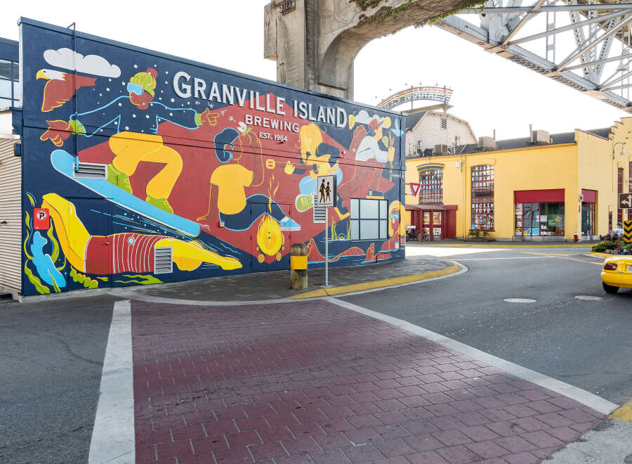 Discover the charm of Granville Island with this vibrant street scene.