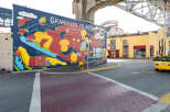 Discover the charm of Granville Island with this vibrant street scene.