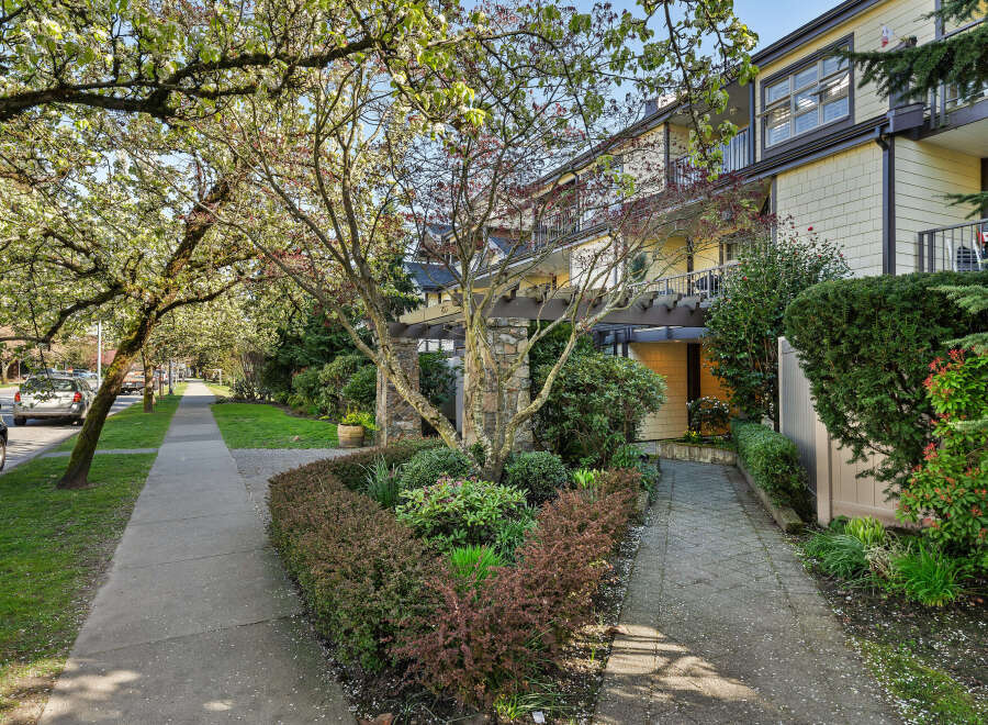 Discover the charm of this beautiful property, featuring lush landscaping and a welcoming entrance.