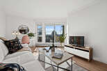 This stunning living room boasts a bright and airy atmosphere, perfect for relaxation and entertaining.