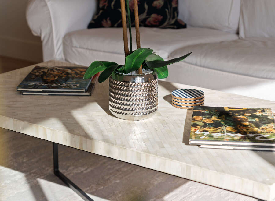 This stunning living room features a stylish coffee table with a unique mosaic design, perfect for adding a touch of elegance to your home.