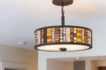 This stunning property features a unique and stylish light fixture, adding a touch of elegance to the space.