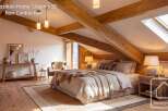 Experience the epitome of rustic elegance in this stunning bedroom.