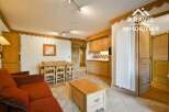 Discover the charm of this inviting property, featuring a cozy living area with a comfortable sofa and a dining space perfect for gatherings.