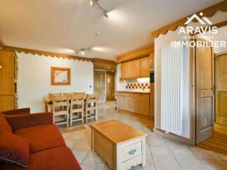 Discover the charm of this inviting property, featuring a cozy living area with a comfortable sofa and a dining space perfect for gatherings.