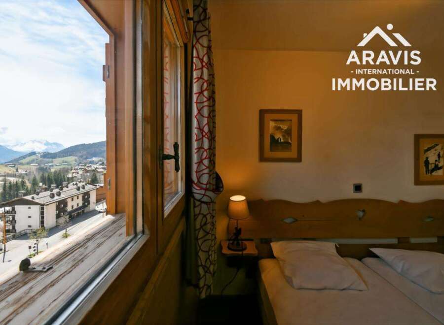 Experience breathtaking mountain views from this cozy bedroom.