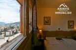 Experience breathtaking mountain views from this cozy bedroom.