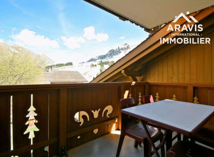 Enjoy breathtaking mountain views from this charming balcony.